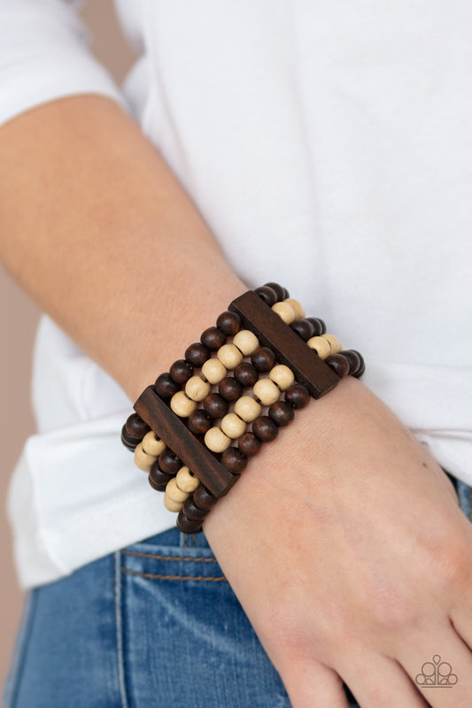 &lt;p&gt; Held in place by rectangular wooden frames, strands of brown and white wooden beads are threaded along stretchy bands around the wrist for a colorfully tropical look.&lt;/p&gt;

&lt;p&gt;&lt;i&gt; Sold as one individual bracelet.&lt;/i&gt;&lt;/p&gt;


