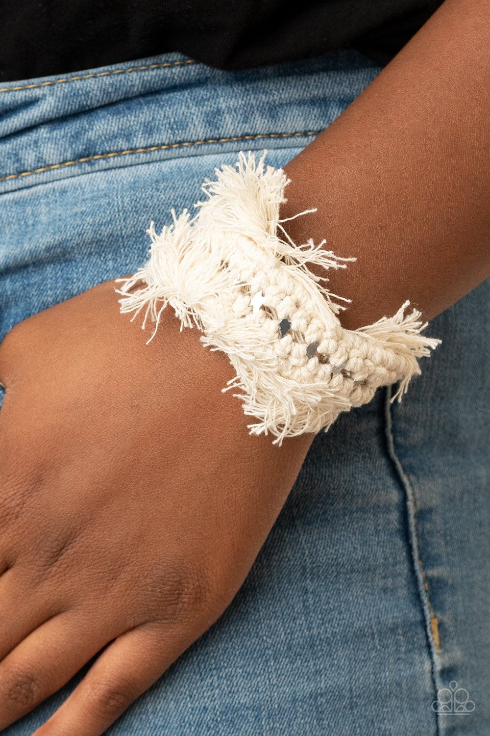 &lt;p&gt;Twine-like thread decoratively knots around an airy silver cuff, creating a macramé inspired fringe around the wrist.&lt;/p&gt;
&lt;p&gt;&lt;i&gt; Sold as one individual bracelet.&lt;/i&gt;&lt;/p&gt;