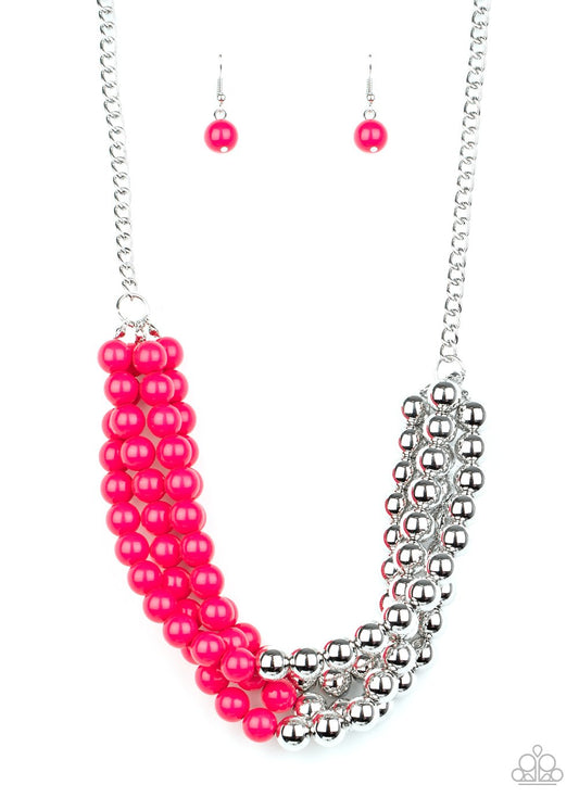 &lt;p&gt; Featuring half silver and half pink beads, a colorful collision of beads layer below the collar for a powerful pop of color. Features an adjustable clasp closure.&lt;/p&gt;

&lt;p&gt;&lt;i&gt; Sold as one individual necklace.  Includes one pair of matching earrings.
&lt;/i&gt;&lt;/p&gt;

&lt;img src=\&quot;https://d9b54x484lq62.cloudfront.net/paparazzi/shopping/images/517_tag150x115_1.png\&quot; alt=\&quot;New Kit\&quot; align=\&quot;middle\&quot; height=\&quot;50\&quot; width=\&quot;50\&quot;&gt;