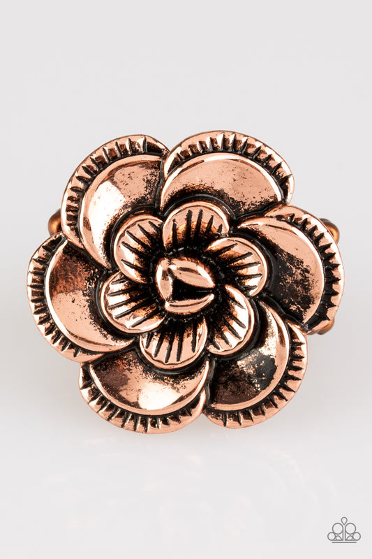 &lt;P&gt;Rippling in ornate detail, folds of copper petals bloom atop the finger for a seasonal look. Features a stretchy band for a flexible fit.
 &lt;/P&gt;  

&lt;P&gt; &lt;I&gt;  Sold as one individual ring.
&lt;/I&gt;&lt;/P&gt;

&lt;img src=\&quot;https://d9b54x484lq62.cloudfront.net/paparazzi/shopping/images/517_tag150x115_1.png\&quot; alt=\&quot;New Kit\&quot; align=\&quot;middle\&quot; height=\&quot;50\&quot; width=\&quot;50\&quot;/&gt;