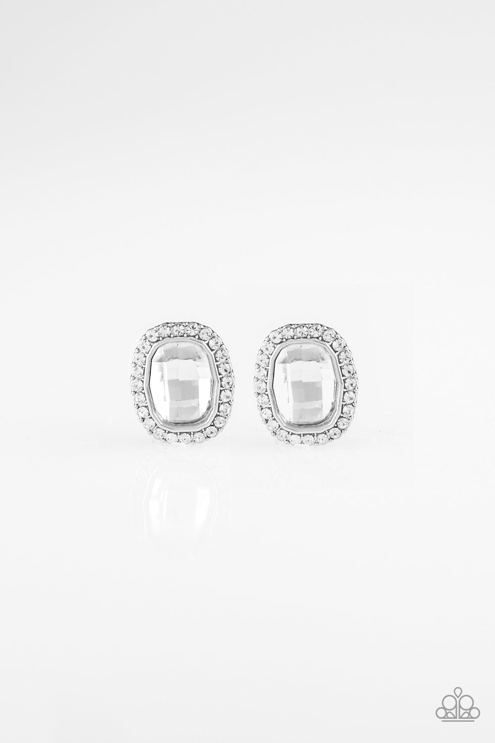&lt;p&gt;A faceted white gem is pressed into a shimmery silver frame radiating with glassy white rhinestones for a timeless fashion. Earring attaches to a standard post fitting. &lt;/p&gt;

&lt;P&gt; &lt;I&gt;Sold as one pair of post earrings.&lt;/I&gt;&lt;/P&gt;


&lt;img src=\&quot;https://d9b54x484lq62.cloudfront.net/paparazzi/shopping/images/517_tag150x115_1.png\&quot; alt=\&quot;New Kit\&quot; align=\&quot;middle\&quot; height=\&quot;50\&quot; width=\&quot;50\&quot;/&gt;