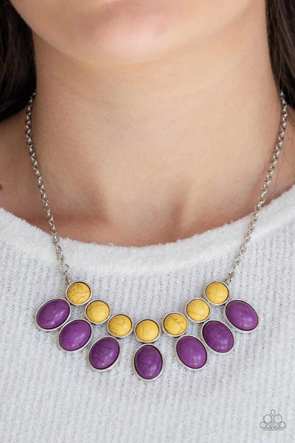 &lt;p&gt;Round yellow stone beads connect to oval purple stone beads, creating an earthy fringe below the collar for a seasonal look. Features an adjustable clasp closure.&lt;/p&gt;

&lt;p&gt;&lt;i&gt; Sold as one individual necklace.  Includes one pair of matching earrings.
&lt;/i&gt;&lt;/p&gt;

