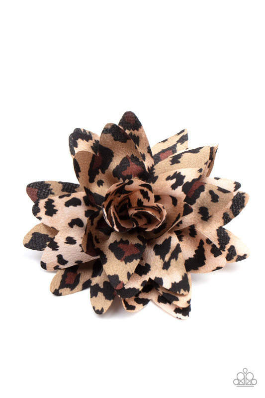 &lt;p&gt; Featuring animal inspired patterns, mismatched petals gather into a wildly wonderful blossom. Features a standard hair clip on the back.&lt;/p&gt;

&lt;p&gt;&lt;i&gt;Sold as one individual hair clip. &lt;/i&gt;&lt;/p&gt;


