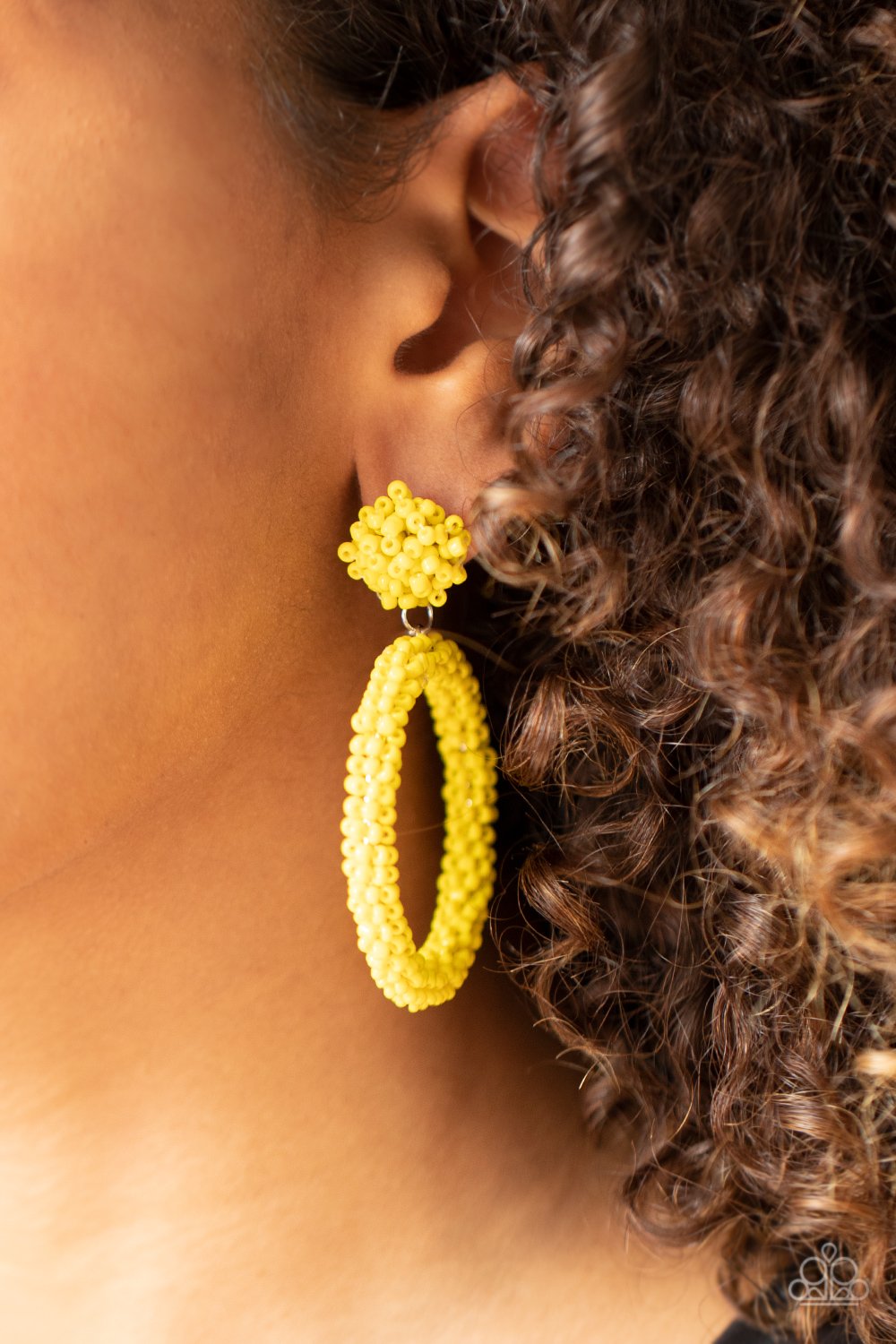 &lt;p&gt;A sunny collection of dainty yellow seed beads are woven around a circular frame at the bottom of a matching beaded fitting, creating a colorful hoop. Earring attaches to a standard post fitting.&lt;/p&gt;  

&lt;p&gt; &lt;i&gt;  Sold as one pair of post earrings. &lt;/i&gt;  &lt;/p&gt;


&lt;img src=\&quot;https://d9b54x484lq62.cloudfront.net/paparazzi/shopping/images/517_tag150x115_1.png\&quot; alt=\&quot;New Kit\&quot; align=\&quot;middle\&quot; height=\&quot;50\&quot; width=\&quot;50\&quot;&gt;