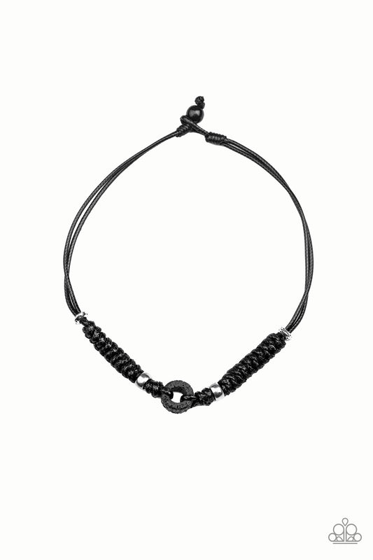 &lt;P&gt;Infused with shiny silver accents, black braided cording knots around an earthy lava stone pendant for an urban look. Features a button loop closure.&lt;/P&gt;  

&lt;P&gt; &lt;I&gt; Sold as one individual necklace.&lt;/I&gt;  &lt;/P&gt;


&lt;img src=\&quot;https://d9b54x484lq62.cloudfront.net/paparazzi/shopping/images/517_tag150x115_1.png\&quot; alt=\&quot;New Kit\&quot; align=\&quot;middle\&quot; height=\&quot;50\&quot; width=\&quot;50\&quot;/&gt;