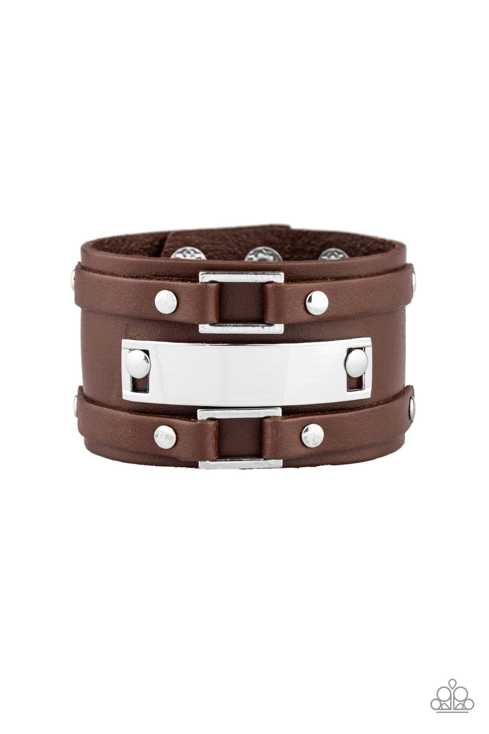 &lt;P&gt;A collection of leather pieces and shiny silver frames are studded in place across the front of a thick leather band, creating an abstract buckle. Features an adjustable snap closure.
&lt;/P&gt;  

&lt;P&gt; &lt;I&gt;Sold as one individual bracelet. &lt;/I&gt;&lt;/P&gt;

&lt;img src=\&quot;https://d9b54x484lq62.cloudfront.net/paparazzi/shopping/images/517_tag150x115_1.png\&quot; alt=\&quot;New Kit\&quot; align=\&quot;middle\&quot; height=\&quot;50\&quot; width=\&quot;50\&quot;/&gt;