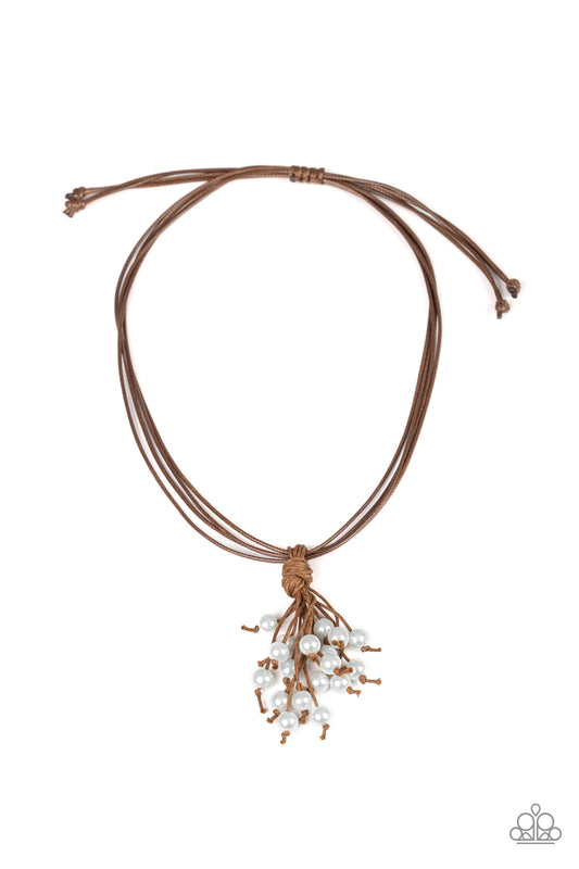 &lt;P&gt;A pearl beaded tassel knots around strands of shiny brown cording below the collar for a seasonal look. Features an adjustable sliding knot closure.
&lt;/p&gt;

&lt;P&gt;&lt;i&gt;  Sold as one individual necklace.  &lt;/i&gt;&lt;/p&gt;

&lt;imgsrc=\&quot;https://d9b54x484lq62.cloudfront.net/paparazzi/shopping/images/517_tag150x115_1.png\&quot; alt=\&quot;New Kit\&quot; align=\&quot;middle\&quot; height=\&quot;50\&quot; width=\&quot;50\&quot;/&gt;