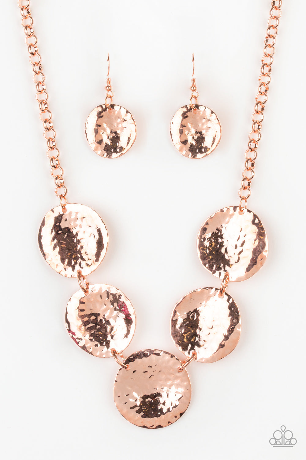 &lt;P&gt;Featuring a hammered high-sheen finish, imperfect round shiny copper frames link below the collar for a casual look. Features an adjustable clasp closure.&lt;/p&gt;

&lt;P&gt;&lt;i&gt; Sold as one individual necklace.  Includes one pair of matching earrings.
&lt;/i&gt;&lt;/p&gt;

&lt;img src=\&quot;https://d9b54x484lq62.cloudfront.net/paparazzi/shopping/images/517_tag150x115_1.png\&quot; alt=\&quot;New Kit\&quot; align=\&quot;middle\&quot; height=\&quot;50\&quot; width=\&quot;50\&quot;/&gt;