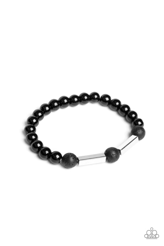 &lt;P&gt;An earthy collection of rectangular silver accents, round black lava rock beads, and shiny black beads are threaded along a stretchy band around the wrist for a seasonal look.&lt;/P&gt;  

&lt;P&gt; &lt;I&gt;Sold as one individual bracelet. &lt;/I&gt;&lt;/P&gt;

&lt;img src=\&quot;https://d9b54x484lq62.cloudfront.net/paparazzi/shopping/images/517_tag150x115_1.png\&quot; alt=\&quot;New Kit\&quot; align=\&quot;middle\&quot; height=\&quot;50\&quot; width=\&quot;50\&quot;/&gt;