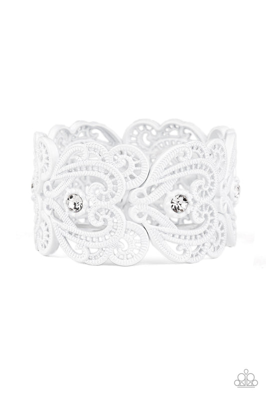 &lt;P&gt;Painted in a refreshing white finish, lacy metallic frames are threaded along stretchy bands around the wrist. Glassy white rhinestones dot each frame, adding elegant shimmer to the whimsical piece.&lt;/P&gt;  

&lt;P&gt; &lt;I&gt;Sold as one individual bracelet.&lt;/I&gt;  &lt;/P&gt;


&lt;img src=\&quot;https://d9b54x484lq62.cloudfront.net/paparazzi/shopping/images/517_tag150x115_1.png\&quot; alt=\&quot;New Kit\&quot; align=\&quot;middle\&quot; height=\&quot;50\&quot; width=\&quot;50\&quot;/&gt;