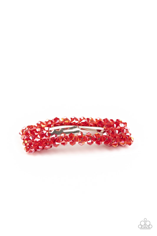 &lt;P&gt; Featuring an iridescent shimmer, faceted red crystal-like beads bedazzle the front of a rectangular hair clip for a sparkly finish. Features a standard snap clip on the back.&lt;/P&gt;

&lt;P&gt;&lt;I&gt;Sold as one individual hair clip.&lt;/I&gt;&lt;/P&gt;


&lt;img src=\&quot;https://d9b54x484lq62.cloudfront.net/paparazzi/shopping/images/517_tag150x115_1.png\&quot; alt=\&quot;New Kit\&quot; align=\&quot;middle\&quot; height=\&quot;50\&quot; width=\&quot;50\&quot;/&gt;