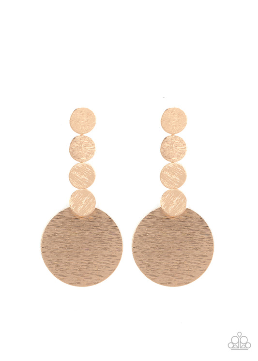 &lt;P&gt;
Featuring a delicately scratched surface, a row of dainty gold discs connects to a large gold disc, creating a bold display. Earring attaches to a standard post fitting.
  &lt;/P&gt;  

&lt;P&gt; &lt;I&gt; Sold as one pair of post earrings.  &lt;/I&gt;  &lt;/P&gt;


&lt;img src=\&quot;https://d9b54x484lq62.cloudfront.net/paparazzi/shopping/images/517_tag150x115_1.png\&quot; alt=\&quot;New Kit\&quot; align=\&quot;middle\&quot; height=\&quot;50\&quot; width=\&quot;50\&quot;/&gt;