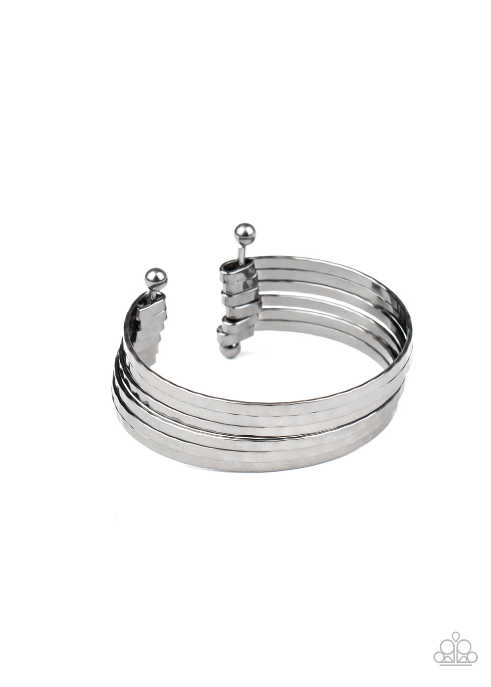 &lt;P&gt;Brushed in a high-sheen shimmer, hammered gunmetal bars arc across the wrist. The flattened bars connect to two rod fittings, creating a trendy layered cuff.
&lt;/P&gt;  

&lt;P&gt; &lt;I&gt;Sold as one individual bracelet.&lt;/I&gt;  &lt;/P&gt;


&lt;img src=\&quot;https://d9b54x484lq62.cloudfront.net/paparazzi/shopping/images/517_tag150x115_1.png\&quot; alt=\&quot;New Kit\&quot; align=\&quot;middle\&quot; height=\&quot;50\&quot; width=\&quot;50\&quot;/&gt;