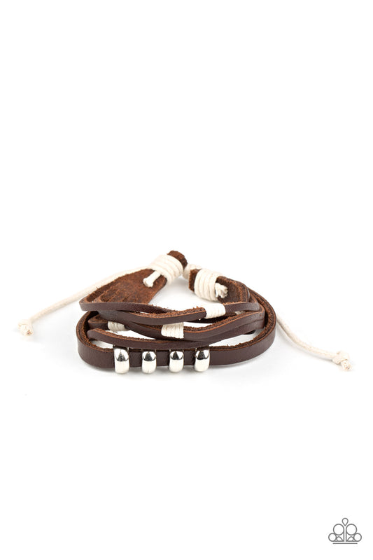 &lt;P&gt;Featuring white threaded and silver beaded accents, mismatched strands of brown leather bands layer across the wrist for an earthy flair. Features an adjustable sliding knot closure.&lt;/P&gt;  

&lt;P&gt; &lt;I&gt;Sold as one individual bracelet.&lt;/I&gt;  &lt;/P&gt;


&lt;img src=\&quot;https://d9b54x484lq62.cloudfront.net/paparazzi/shopping/images/517_tag150x115_1.png\&quot; alt=\&quot;New Kit\&quot; align=\&quot;middle\&quot; height=\&quot;50\&quot; width=\&quot;50\&quot;/&gt;
