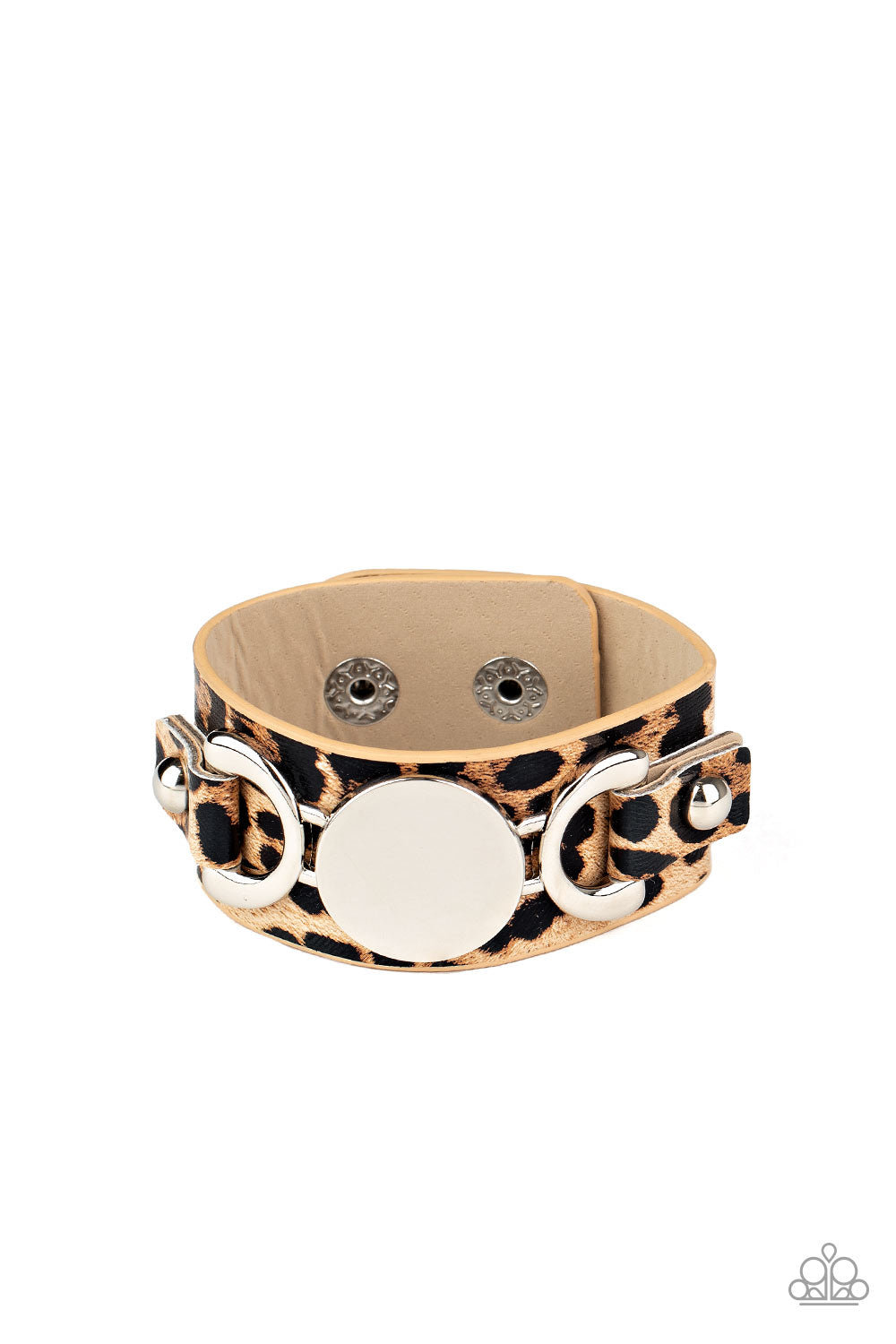 &lt;P&gt;A silver buckle-like centerpiece is studded in place across the front of a thick leather band painted in brown cheetah print. Features an adjustable snap closure.&lt;/P&gt;  

&lt;P&gt; &lt;I&gt;Sold as one individual bracelet.&lt;/I&gt;  &lt;/P&gt;


&lt;img src=\&quot;https://d9b54x484lq62.cloudfront.net/paparazzi/shopping/images/517_tag150x115_1.png\&quot; alt=\&quot;New Kit\&quot; align=\&quot;middle\&quot; height=\&quot;50\&quot; width=\&quot;50\&quot;/&gt;