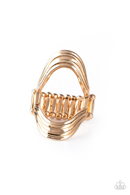 &lt;P&gt; Rippling gold bars radiate out from an airy center, allowing the skin to peek through the open center for a naturally refined finish. Features a stretchy band for a flexible fit.&lt;/P&gt;  

&lt;P&gt; &lt;I&gt;  Sold as one individual ring.
&lt;/I&gt;&lt;/P&gt;

&lt;img src=\&quot;https://d9b54x484lq62.cloudfront.net/paparazzi/shopping/images/517_tag150x115_1.png\&quot; alt=\&quot;New Kit\&quot; align=\&quot;middle\&quot; height=\&quot;50\&quot; width=\&quot;50\&quot;/&gt;