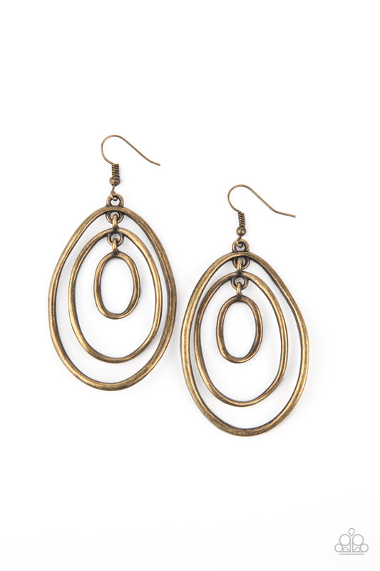 &lt;P&gt;A trio of imperfect brass ovals link into a rippling lure for a dizzying look. Earring attaches to a standard fishhook fitting.
&lt;/P&gt;  

&lt;P&gt; &lt;I&gt;  Sold as one pair of earrings. &lt;/I&gt;  &lt;/P&gt;


&lt;img src=\&quot;https://d9b54x484lq62.cloudfront.net/paparazzi/shopping/images/517_tag150x115_1.png\&quot; alt=\&quot;New Kit\&quot; align=\&quot;middle\&quot; height=\&quot;50\&quot; width=\&quot;50\&quot;/&gt;