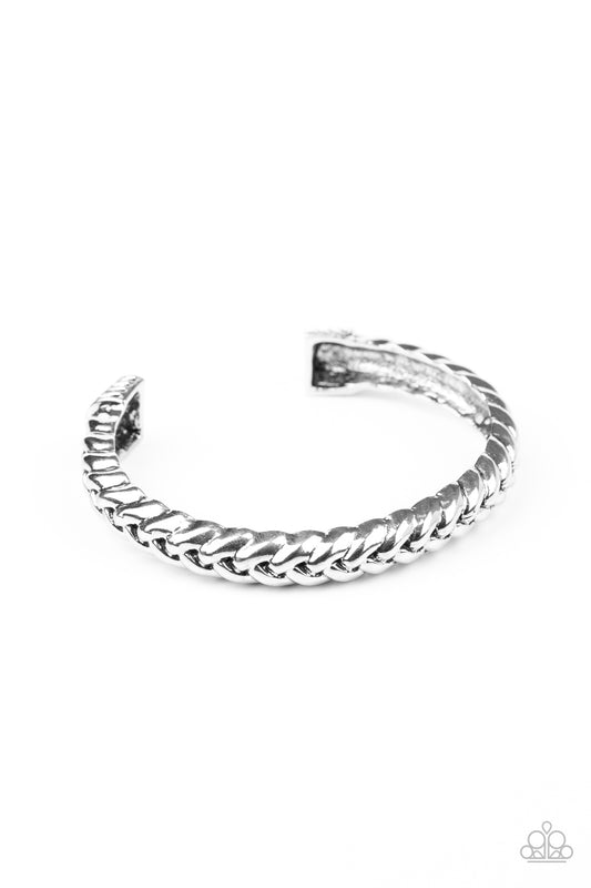 &lt;P&gt; Infused with decorative silver fittings, antiqued silver bars thickly weave into a bold industrial cuff around the wrist.&lt;/P&gt;  

&lt;P&gt; &lt;I&gt;Sold as one individual bracelet. &lt;/I&gt;&lt;/P&gt;

&lt;img src=\&quot;https://d9b54x484lq62.cloudfront.net/paparazzi/shopping/images/517_tag150x115_1.png\&quot; alt=\&quot;New Kit\&quot; align=\&quot;middle\&quot; height=\&quot;50\&quot; width=\&quot;50\&quot;/&gt;
