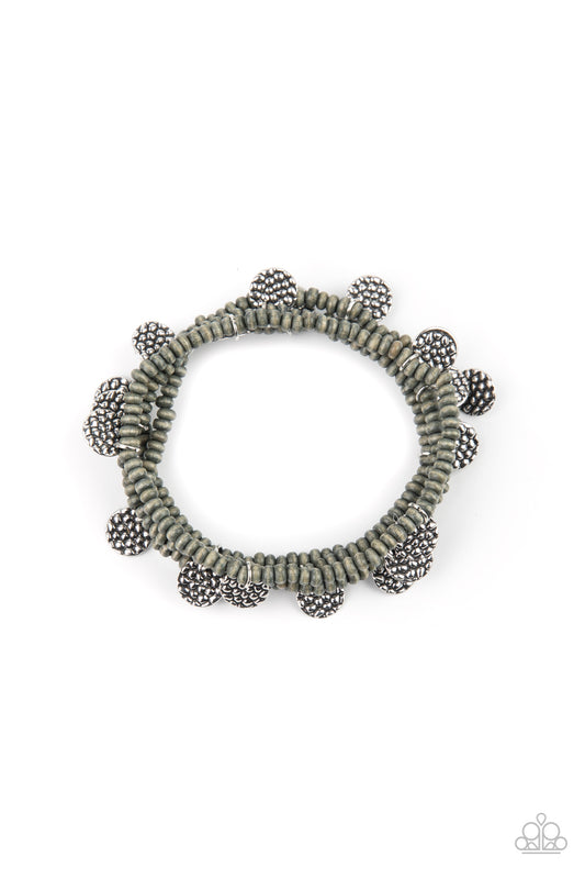 &lt;P&gt; Infused with hammered silver discs, a dainty collection of distressed gray wooden beads are threaded along stretchy bands around the wrist, creating colorful layers.&lt;/P&gt;

&lt;P&gt;&lt;I&gt; Sold as one set of four bracelets. &lt;/I&gt;&lt;/p&gt;

&lt;img src=\&quot;https://d9b54x484lq62.cloudfront.net/paparazzi/shopping/images/517_tag150x115_1.png\&quot; alt=\&quot;New Kit\&quot; align=\&quot;middle\&quot; height=\&quot;50\&quot; width=\&quot;50\&quot;/&gt;