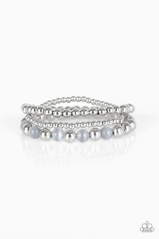 &lt;P&gt;Infused with glowing gray moonstones, shiny silver beads are threaded along stretchy bands for a whimsical look. &lt;/P&gt;

&lt;P&gt;&lt;I&gt; Sold as one set of three bracelets. &lt;/I&gt;&lt;/p&gt;


&lt;imgsrc=\&quot;https://d9b54x484lq62.cloudfront.net/paparazzi/shopping/images/517_tag150x115_1.png\&quot; alt=\&quot;New Kit\&quot; align=\&quot;middle\&quot; height=\&quot;50\&quot; width=\&quot;50\&quot;/&gt;