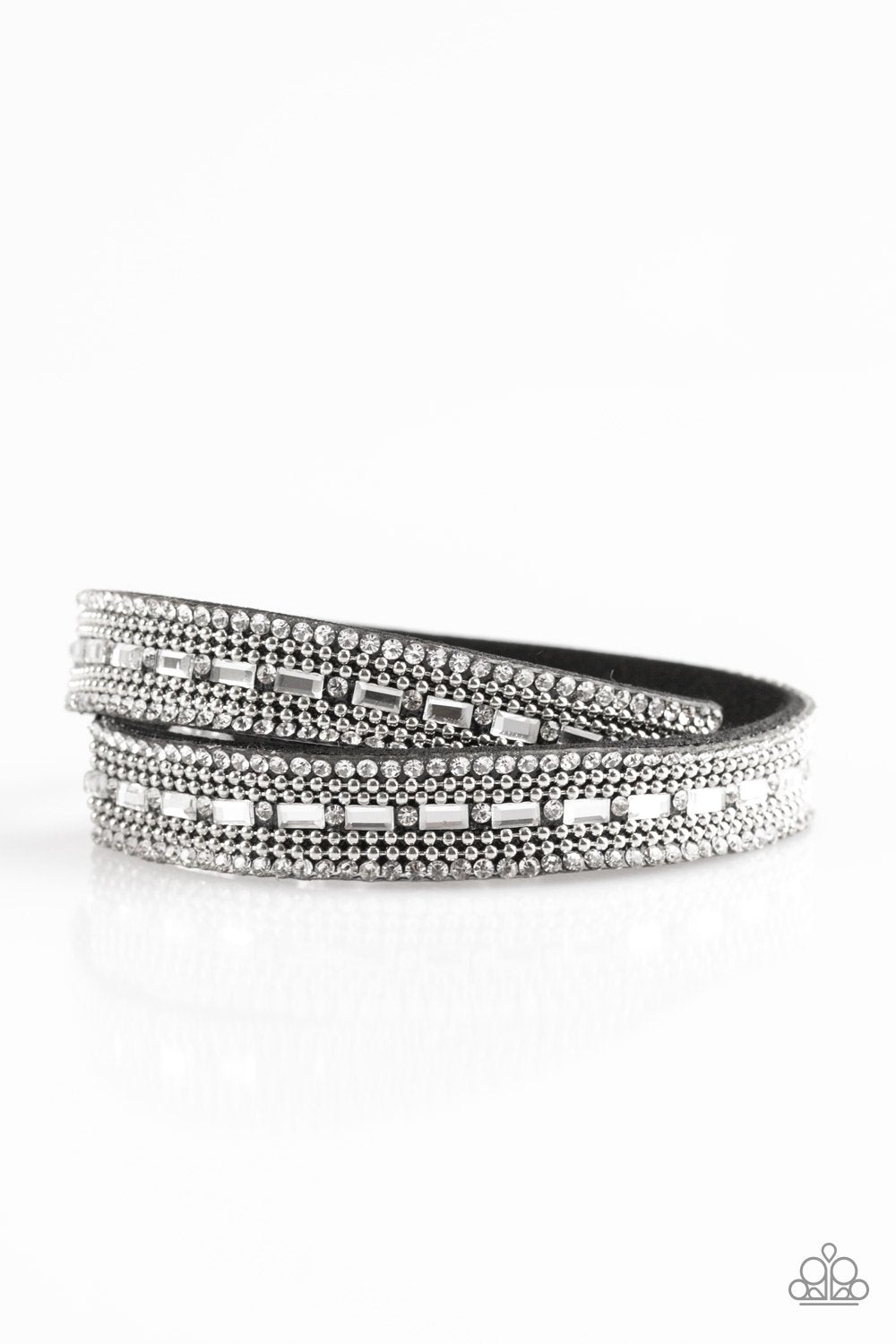 &lt;p&gt;Shimmer and Sass Black - Paparazzi Rhinestone Snap Bracelet. Featuring round and emerald style cuts, glassy white rhinestones are encrusted along a black suede band. Rows of shimmery silver ball-chain are pressed into the glittery band for a sassy finish. The elongated band allows for a trendy double wrap design. Features an adjustable snap closure.&lt;/p&gt;