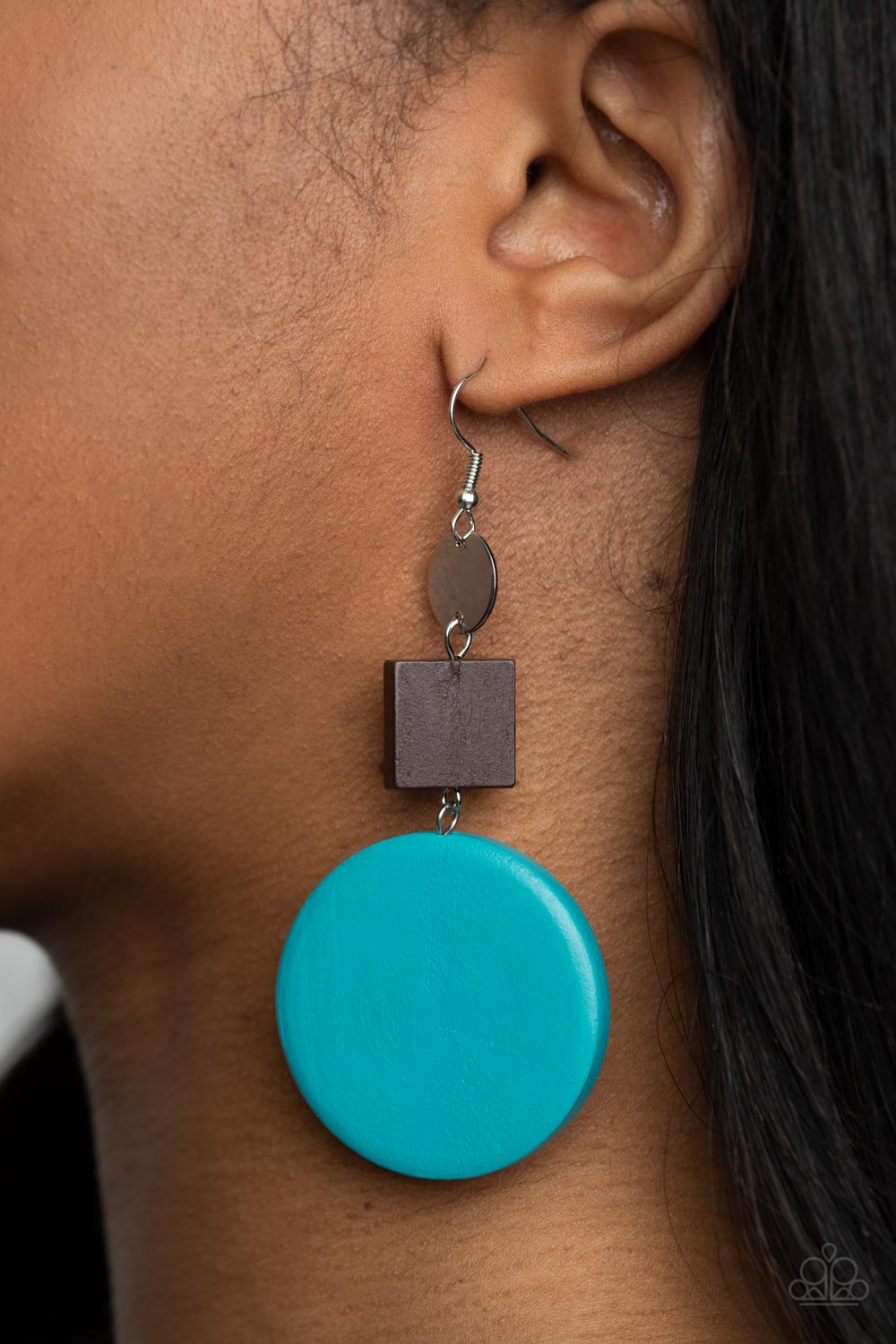 &lt;P&gt;A shiny silver disc, brown wooden square, and oversized blue wooden circle delicately link into a colorfully retro lure for a trendsetting finish. Earring attaches to a standard fishhook fitting. &lt;/P&gt;  

&lt;P&gt; &lt;I&gt;  Sold as one pair of earrings. &lt;/I&gt;  &lt;/P&gt;


&lt;img src=\&quot;https://d9b54x484lq62.cloudfront.net/paparazzi/shopping/images/517_tag150x115_1.png\&quot; alt=\&quot;New Kit\&quot; align=\&quot;middle\&quot; height=\&quot;50\&quot; width=\&quot;50\&quot;/&gt;