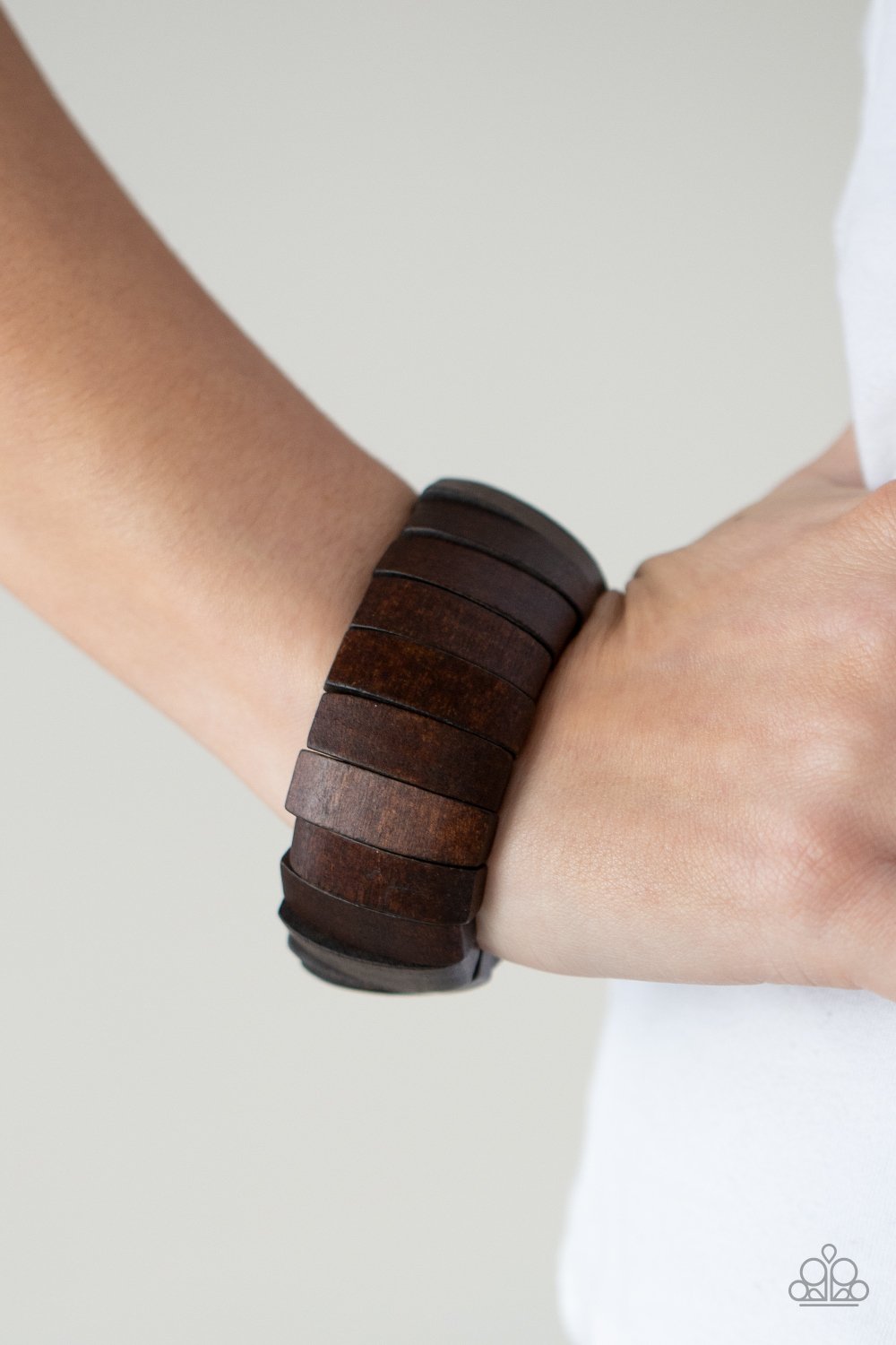 &lt;p&gt;A bold collection of brown wooden beads are threaded along stretchy bands around the wrist for a colorful display.&lt;/p&gt;  
 

 &lt;p&gt; &lt;i&gt;Sold as one individual bracelet.&lt;/i&gt; &lt;/p&gt;
 

 

&lt;h5&gt;Paparazzi Accessories • $5 Jewelry&lt;/h5&gt;