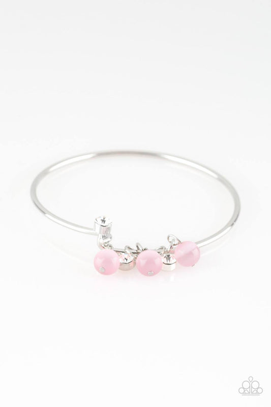 &lt;p&gt;Marine Melody Pink - Paparazzi Bracelet. Glassy pink beads and glittery white rhinestones slide along a dainty silver wire infused with a rhinestone encrusted fitting, creating a versatile adjustable like bangle. Features a hinged closure.&lt;/p&gt;