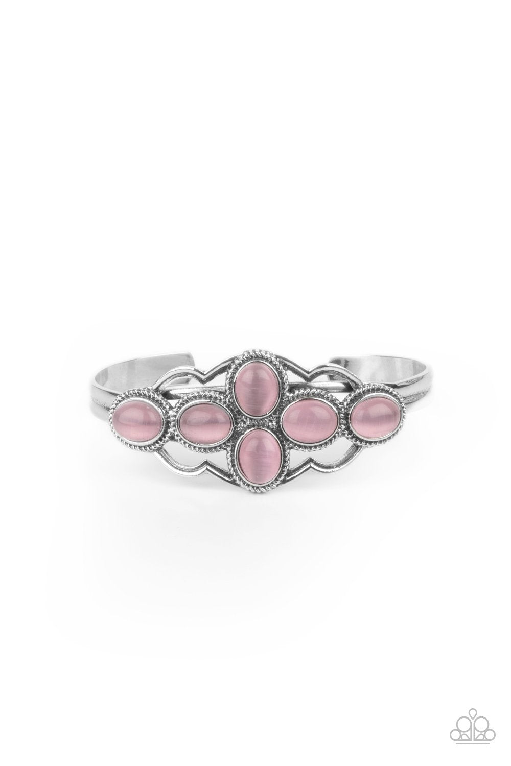 &lt;p&gt;A collection of glowing pink cat\&#039;s eye stones delicately cluster inside a scalloped silver frame, creating an ethereal centerpiece atop a dainty silver cuff.&lt;/p&gt;
 
 &lt;p&gt;&lt;i&gt; Sold as one individual bracelet.&lt;/i&gt;&lt;/p&gt;
 
 
 &lt;img src=\&quot;https://d9b54x484lq62.cloudfront.net/paparazzi/shopping/images/517_tag150x115_1.png\&quot; alt=\&quot;New Kit\&quot; align=\&quot;middle\&quot; height=\&quot;50\&quot; width=\&quot;50\&quot;&gt;