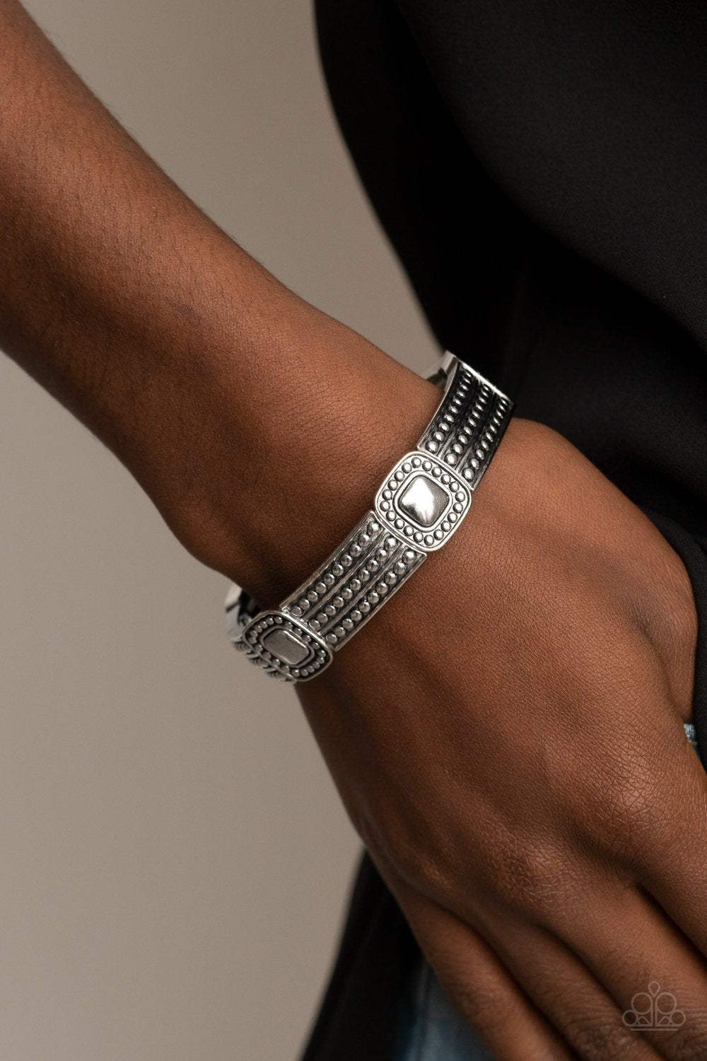 &lt;p&gt;Featuring silver studded patterns, square and rectangular frames are threaded along stretchy bands around the wrist for a rustic flair.&lt;/p&gt;
&lt;p&gt;&lt;i&gt; &lt;/i&gt;&lt;/p&gt;
&lt;div style=\&quot;text-align: center;\&quot;&gt;&lt;b&gt; &lt;/b&gt;&lt;/div&gt;
