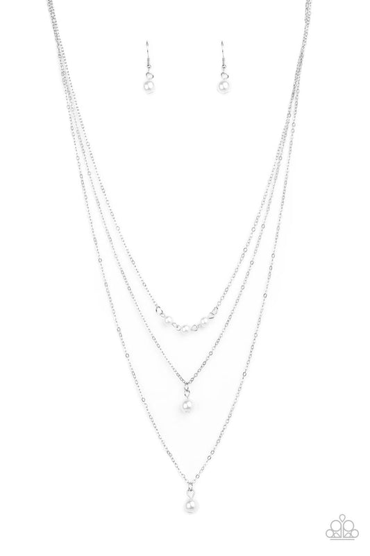 &lt;p&gt;A trio of pearly white beads give way to layers of solitaire white pearl pendants below the collar for a refined flair. Features an adjustable clasp closure.&lt;/p&gt;

&lt;p&gt;&lt;i&gt; Sold as one individual necklace.  Includes one pair of matching earrings.
&lt;/i&gt;&lt;/p&gt;

&lt;img src=\&quot;https://d9b54x484lq62.cloudfront.net/paparazzi/shopping/images/517_tag150x115_1.png\&quot; alt=\&quot;New Kit\&quot; align=\&quot;middle\&quot; height=\&quot;50\&quot; width=\&quot;50\&quot;&gt;