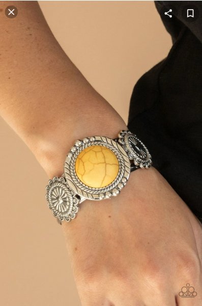 &lt;p&gt;Flanked by two studded silver floral frames, an oversized yellow stone adorns the center of a layered silver cuff for an authentic southwestern flair.&lt;/p&gt;

&lt;p&gt;&lt;i&gt; Sold as one individual bracelet.&lt;/i&gt;&lt;/p&gt;


